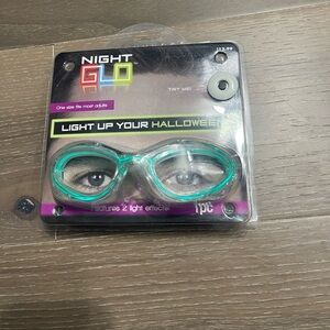Night Glo light up mask green. NWT